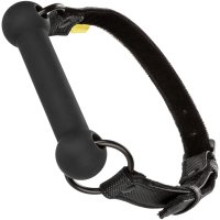 Cal Exotics Boundless Silicone Big Gag. A semi-thick, silicone bit gag is between the two O-rings where it will rest in the mouth. A black fastener straps it around the head.