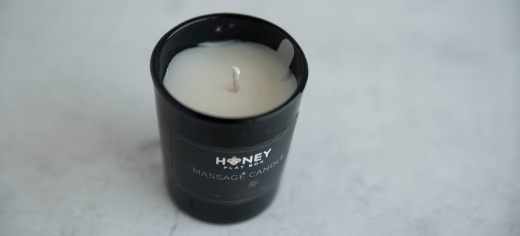 Honey Play Box Rose Mini Massage Candle. Top down view shows the candle liner and the wick inside of the candle. 