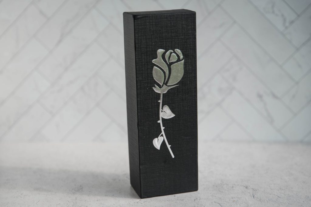 Sohimi Rose Queen Vibrator review. The black packaging for the air suction vibrator that has a rose emblazoned on the packaging.