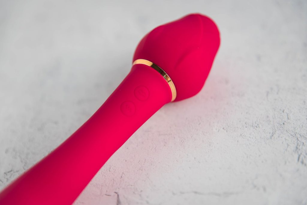 Sohimi Rose Queen Vibrator review. Close up of the buttons along the shaft. This also shows of the plastic ring beneath the Rose tip of the air suction functionality.