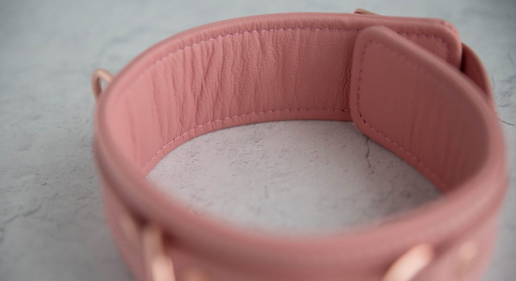 Liebe Seele Pinku Pink Collar and Leash: Close-up of the soft, textured material of the leather on the interior side of the collar. No view of the rivets can be seen from the interior of the collar.