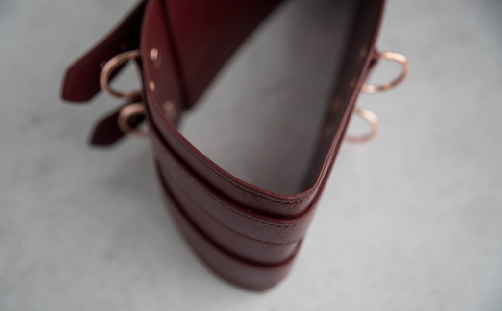 Liebe Seele Wine Red Waist Cuff Review: Top-down view of the Waist Cuff. This view shows how thin the leather layer is; it's much thinner than the leather used in most kink gear.