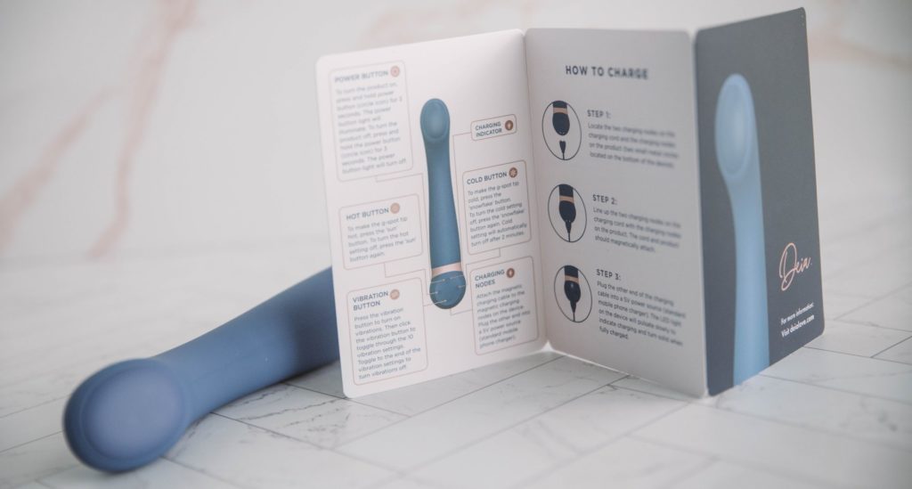 Image for my Deia Hot and Cold review. Close-up of the instruction manual that comes with the vibrator to showcase the quality, design, and full-color of the manual.