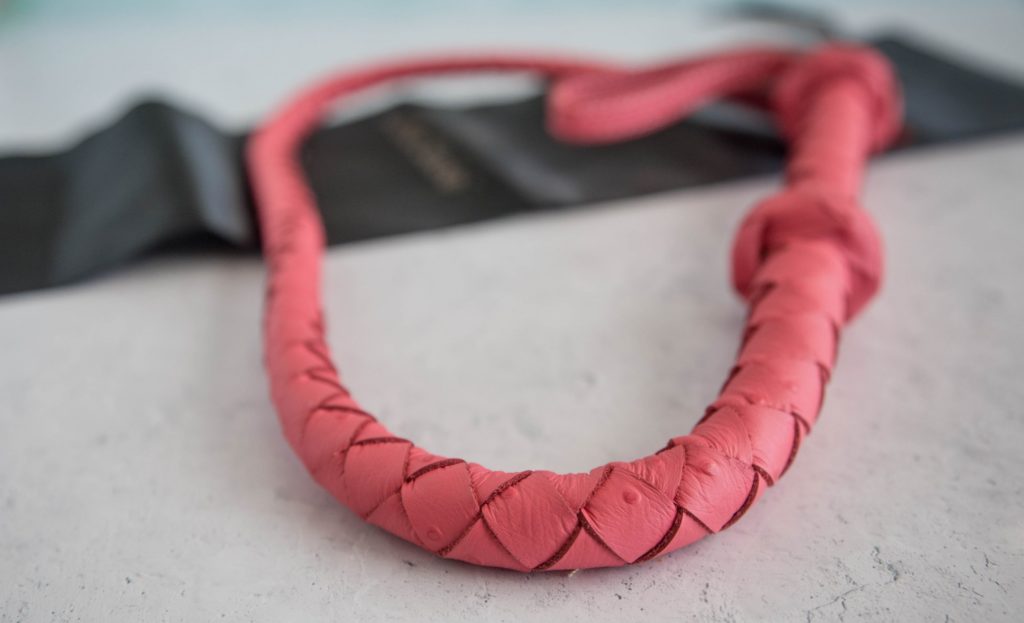 Close-up of the tail of the Whip. This showcases the textured leather used for the whip and the tight braiding of the whip. Image for Liebe Seele Angel's Kiss Bullwhip review.