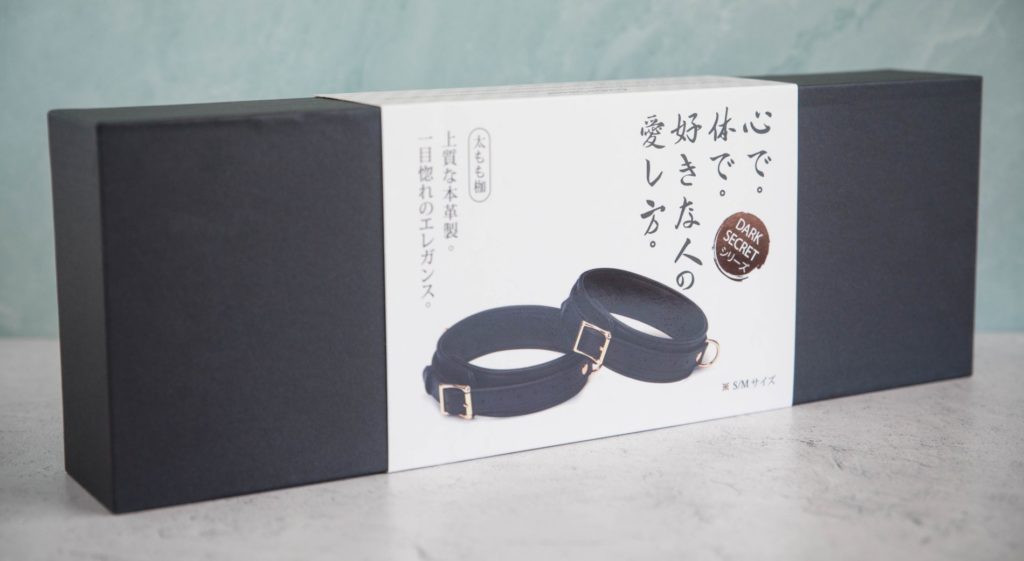 The packaging for the cuffs. It is a plain, black cardboard box with a paper sleeve surrounding the black box. For my Liebe Seele Dark Secret Thigh Cuffs review.