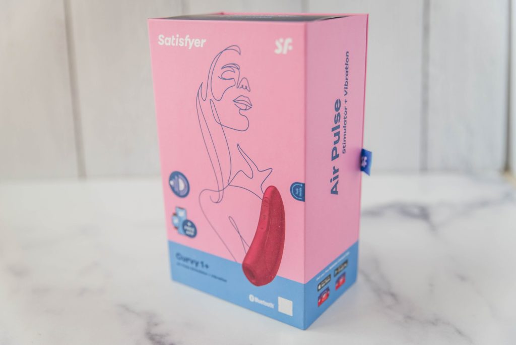 Packaging for the Satisfyer Curvy 1. It is an approachable bright pink and looks modern. For my Satisfyer Curvy 1 review.