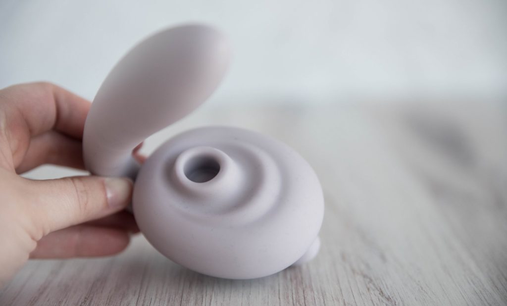 Close-up of the Tracy's Dog OG Flow air suction area. This showcases how far down the clitoral air suction hole is located as well as the rippled texture that extends outwards from the hole.
