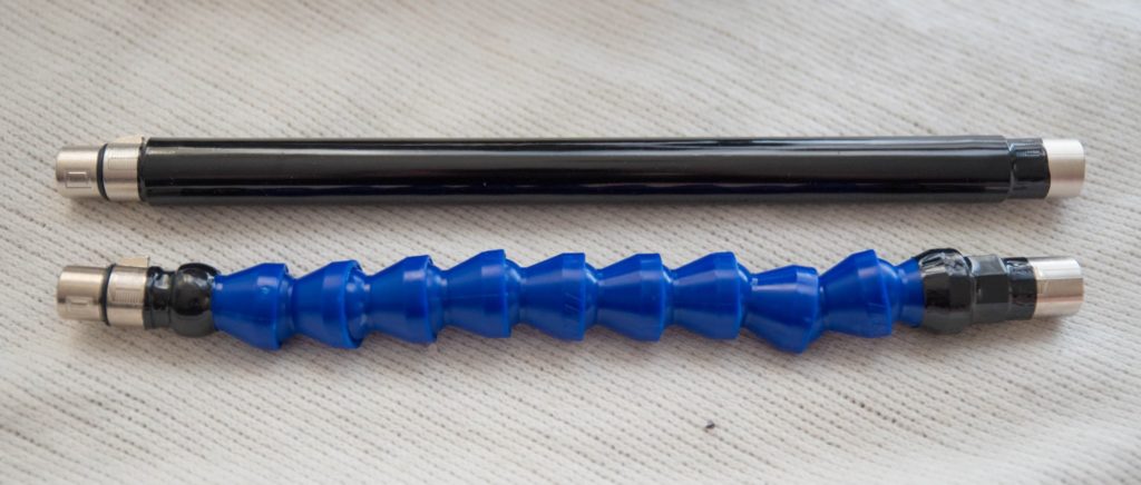 Close-up of the two extender rods included with the sex machine. One is a plain, straight metal rod while the other is a plastic rod made up of bendable joints to allow the rod to bend into unique positions. For Hismith Sex Machine Review 3XLR version.