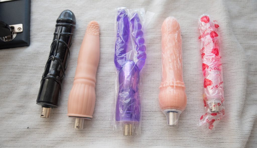 All of the attachments that come with the 3XLR machine. There are five attachments laid out in a line. For Hismith Sex Machine Review 3XLR version.