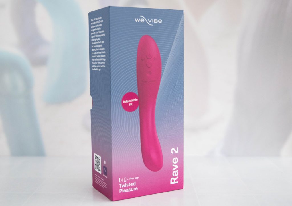 Packaging for the We-Vibe Rave 2. It's a pink and blue box with a modern design.