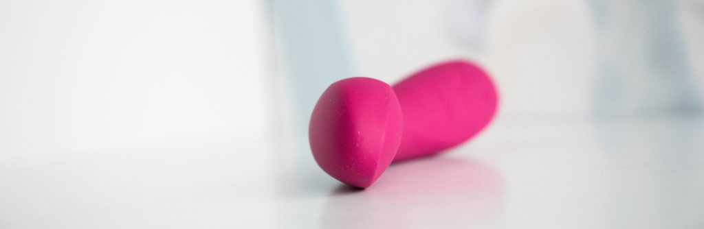 Close-up on the tip of the vibrator. This showcases the asymmetrical design of the tip