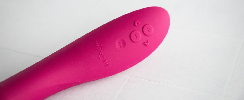Close-up of the control panel buttons on the base of the vibrator. There are five different buttons, some protruding from the base of the vibrator for tactile handling. Image for my We-Vibe Rave 2 review.