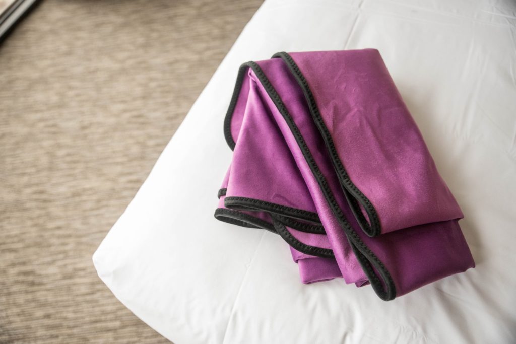 The Liberator Throw blanket folded how I would fold it. It folds over easily into a small pile that could be tossed into luggage or a plastic grocery bag.