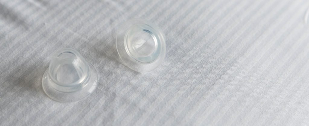A set of clear nipple suckers. They look like see-through domes. For my BDSM Nipple Clamps article.