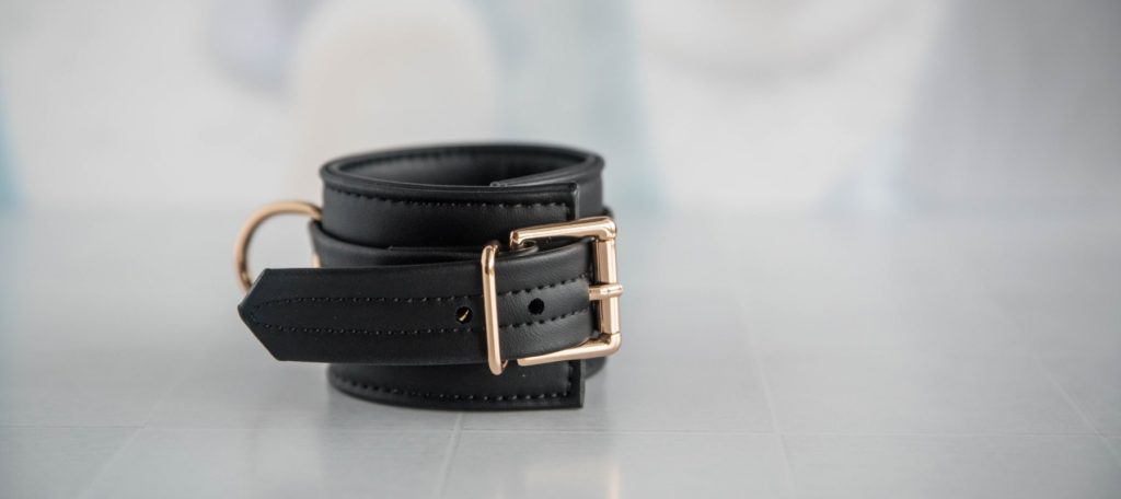 A close-up of the gold buckle on the cuffs. It looks really beautiful and stands out against the black cuff. For my Liebe Seele Dark Candy Cuffs review.