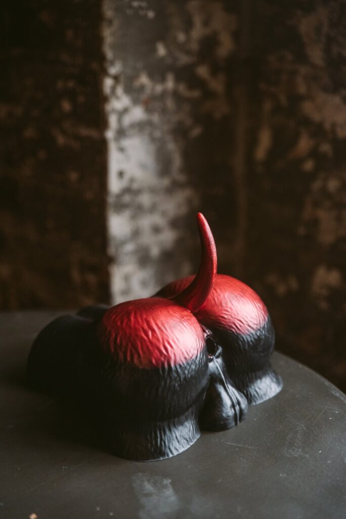The Naberus lays out on top of a tabletop. It has a shiny, curvy butt to it with a pair of obvious, easy-to-see testicles. For my Twisted Beast Naberus review.