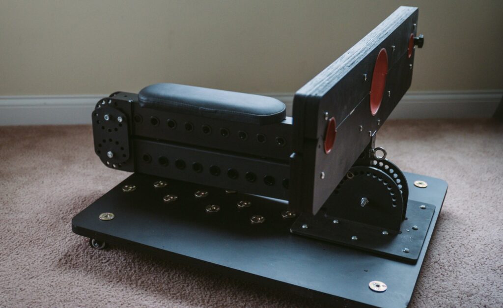 My favorite way to use the sex furniture, as a small, kneeling platform with attached stockade. The L-shaped hinge is entirely folded up onto itself and resting directly on top of the platform. For my Fetdom Multi-Position Floating Stockade Pillory Review.
