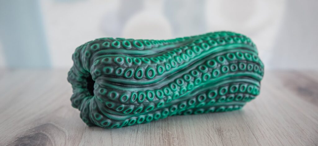 The stroker sits out at an angle, showcasing the impressive depth in texturing and design and coloring of the stroker. For my Nothosaur Vortima review.