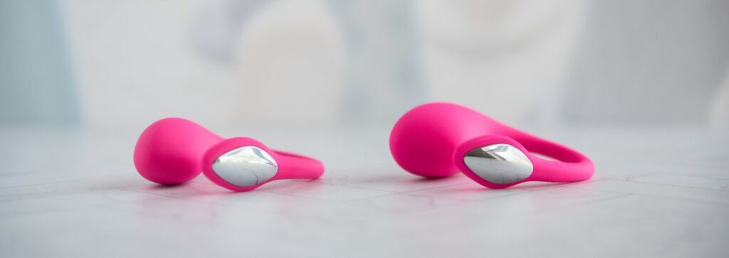 Front view of Lovense Lush Mini (on the left) and Lush 4 (on the right) next to one another. Both look virtually the same except the Lush Mini has a smaller insertable size. The tail sizes are exactly the same.