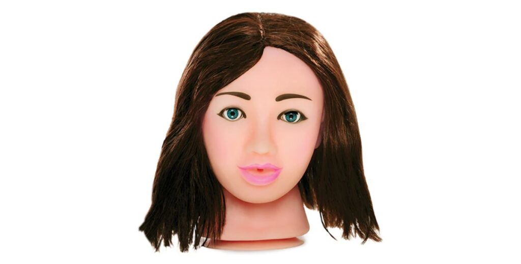 For my gore sex toys article. It's the Pipedream Fuck Face stroker in front of a plain white background. It looks like a decapitated head with fuckable mouth and faux hair and a suction cup neck.