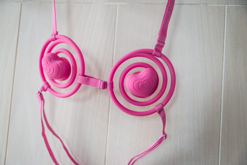 The Vkini hangs, showcasing some of the adjustment points. It has an adjustment buckle shown on the halter strap, one between the cups, and two shown on the behind-the-back strap.