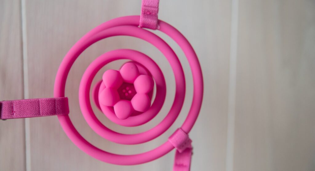 Close up on the wearer's side flower attachment. The petals provide lots of contact while there are textured, protruding dots inside of the flower's center.