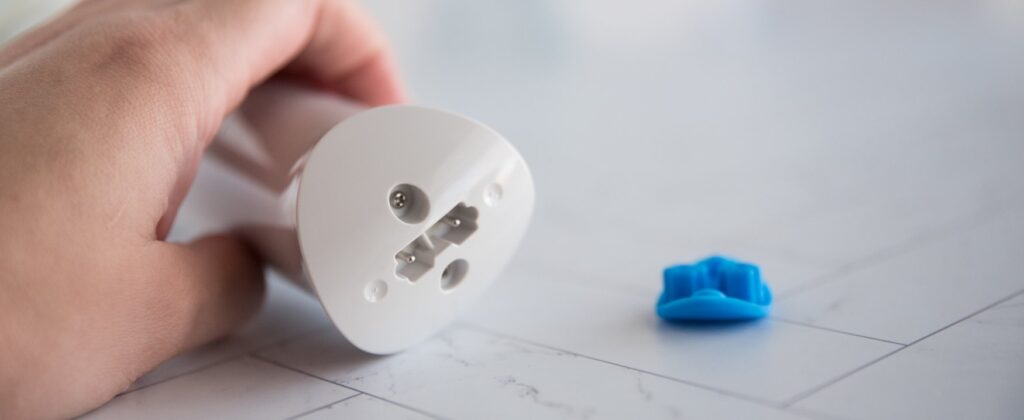 A close-up on the base of the Magic Wand Waterproof. The "waterproof" cap is removed, showcasing how it fully removes from the base of the wand. For my Magic Wand Waterproof review.