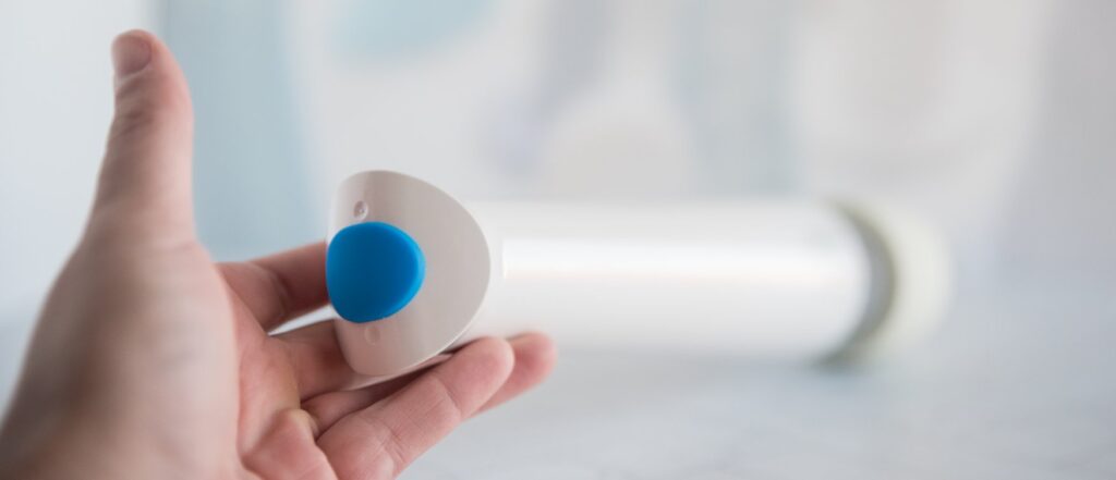 A close-up on the base of the Magic Wand Waterproof. The "waterproof" cap is plugged into its charging port, showcasing how it fully removes from the base of the wand. For my Magic Wand Waterproof review.