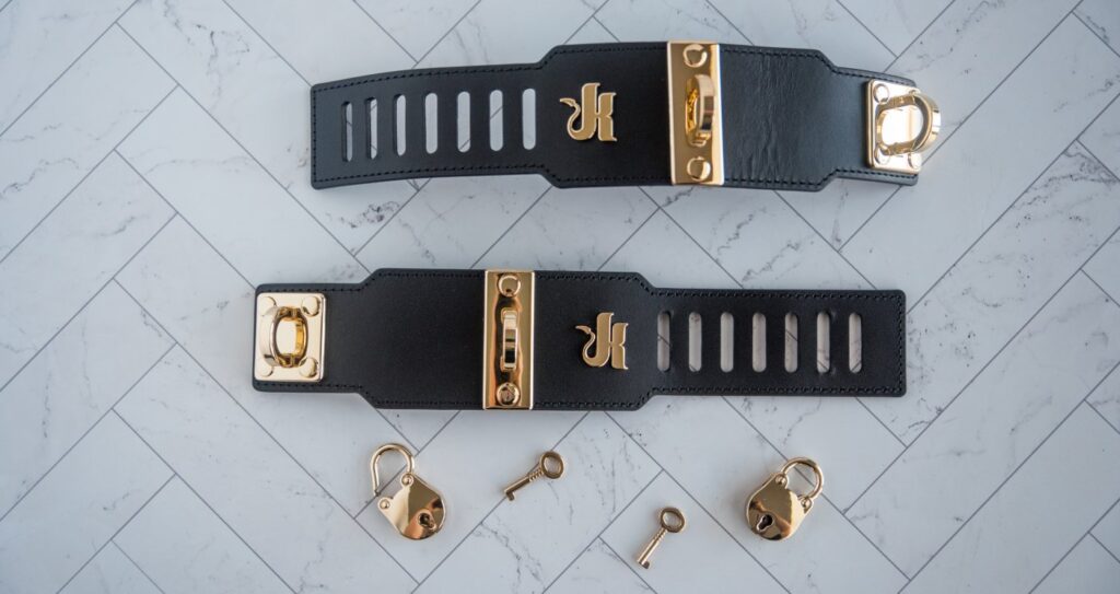 Everything included with this cuff set. It has both cuffs, two locks, two keys, and the fastener lock. For my Kink.com Gold Eclipse Wrist Cuff Set review.