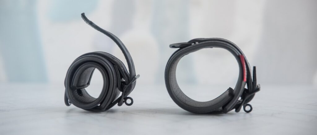 Both cuffs are shown side-by-side. The left cuff is fastened as small as it will go. The right cuff is fastened as wide as it will go. For my MEO.de Lockable Chicago Neoprene Restraints review.