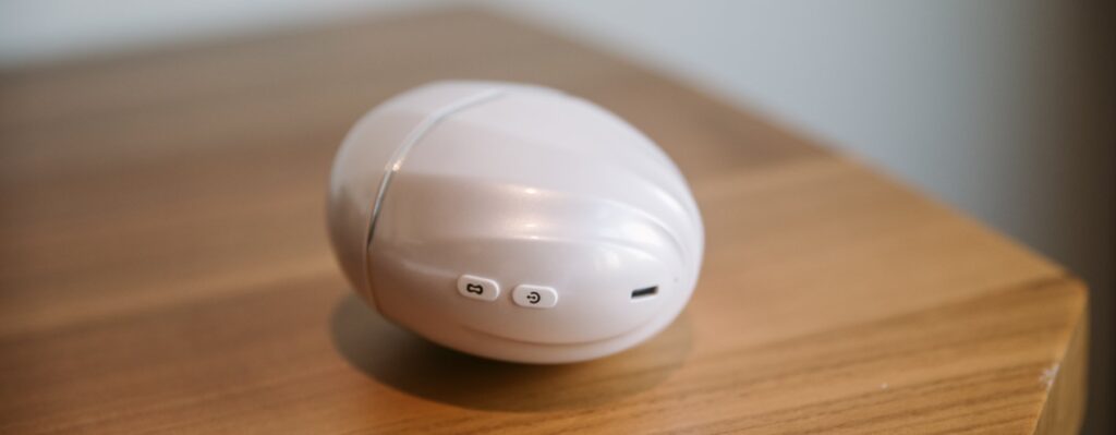 The lid is on the vibrator, and it looks like a really large, oval, glossy plastic egg. For my Joylume Cloud Kiss review.