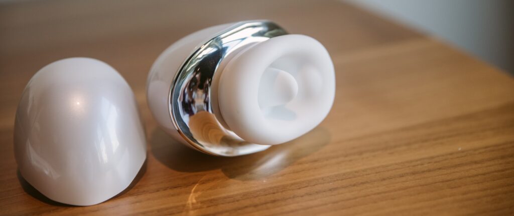 Close-up on the tongue area of the vibrator. There's a small bump on one side of the vibrator designed to add extra stimulation when the mouth moves. For my Joylume Cloud Kiss review.