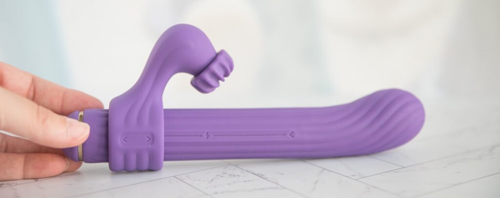 The clitoral attachment shown as close as possible to the base of the vibrator. For my AVIDLOVE PLAY Four-Attachment Rabbit Vibrator review.