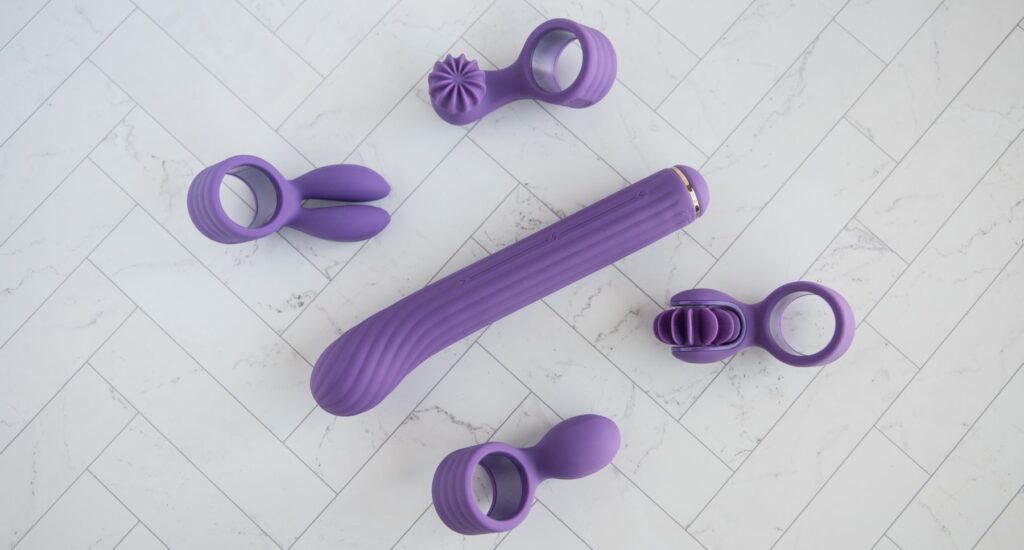 The insertable shaft shown next to all four of the interchangeable clitoral attachments.