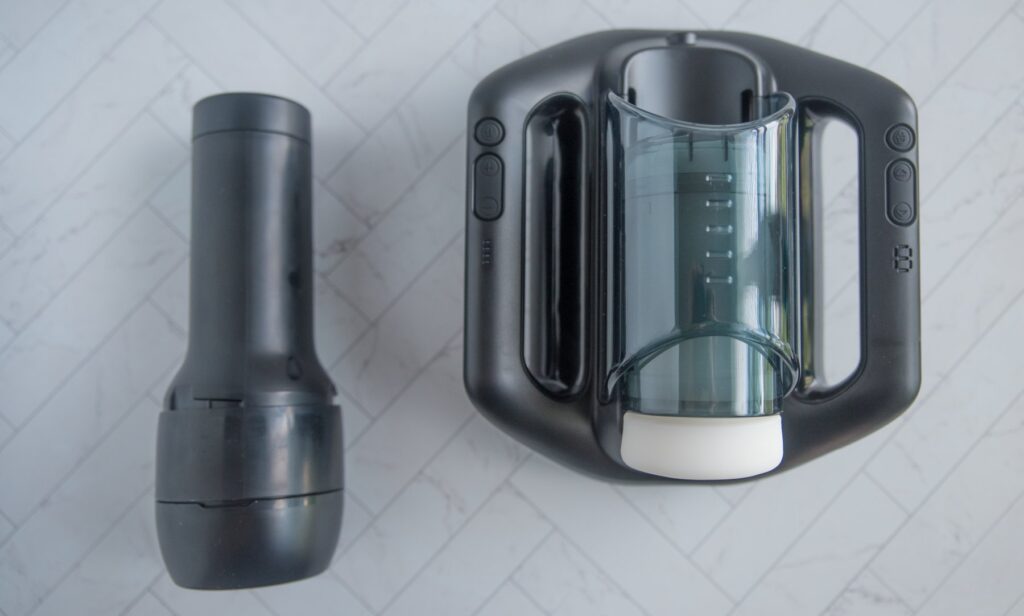 The SVAKOM Jetpack shown next to a standard full-sized KIIROO stroker for scale between the two penis stroking options.