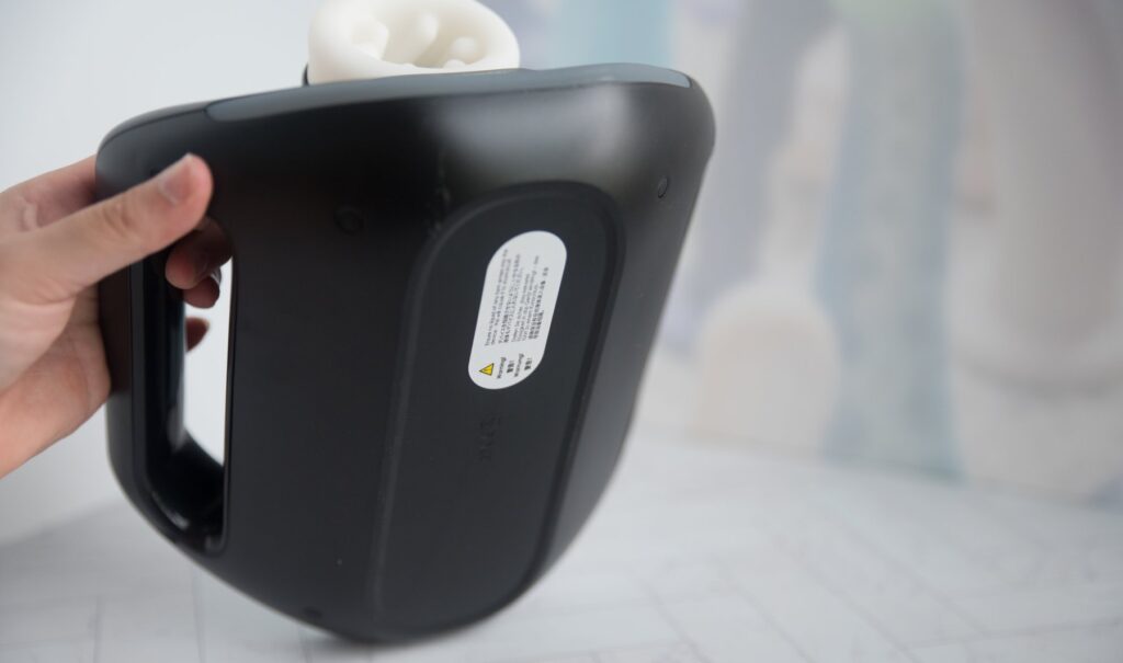 The underside of the machine, showcasing its smooth design and rounded base that makes for easier holding. For my SVAKOM Jetpack review.