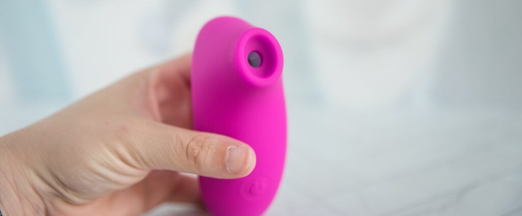 The tip of the toy faces the camera. It has a hollow-out, scooped design for air suction use.