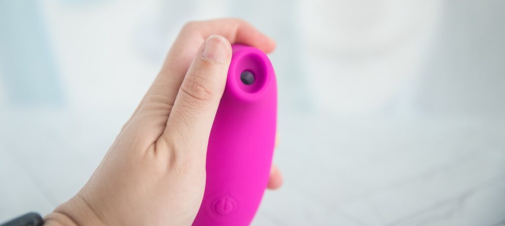 My thumb is placed next to the tip of the toy, showcasing the oval-like shape of the tip.