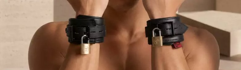 A person's two hands are to the camera, and they are wearing the cuffs. One of the inner wraps of the cuff is slightly off-set from the outermost layer of the cuffs.